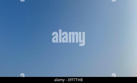 Background photo of Clear Sky with Warm Blue with soft blue gradient at Sunrise or Sunset Stock Photo