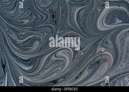 Abstract dark grey and black liquid swirl pattern with smooth marbled paint texture background Stock Photo