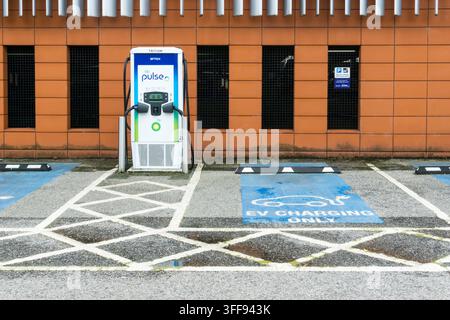 BP Pulse EV charging point in a car park, King's Lynn, Norfolk. Stock Photo