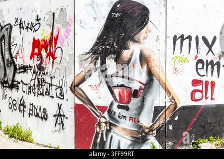 Street art style mural depicting a female silhouette seen from behind Stock Photo