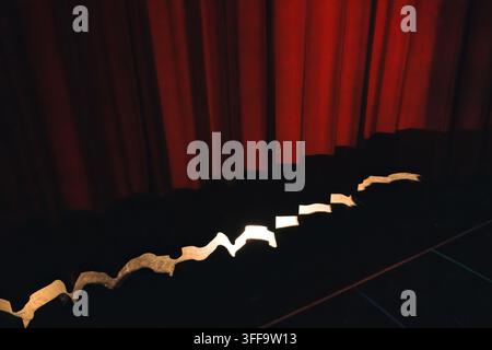 Red theater curtain and stage awaiting show Stock Photo
