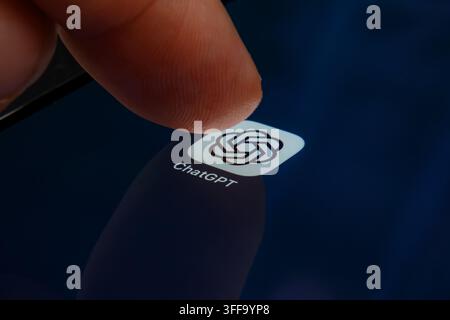 Paris, France - September 7, 2026: A finger pressing the OpenAI ChatGPT logo on a touchscreen display. Stock Photo