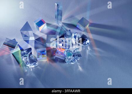 Glass prisms refracting light creating colorful spectrum Stock Photo