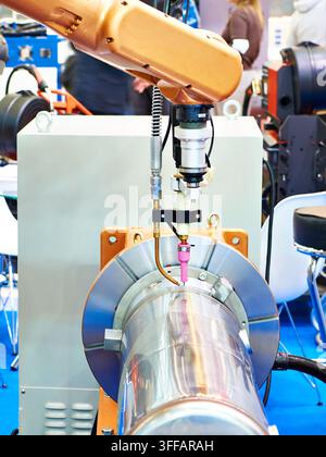 Welding robotic arm manipulator for industry and metal part Stock Photo