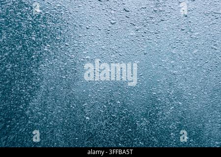 Underwater bubbles forming a natural blue textured background, creating a refreshing liquid surface effect Stock Photo