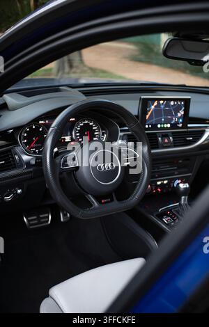 Interior View of an Audi RS6 Avant Station Wagon Cockpit Featuring Leather Steering Wheel and Infotainment Screen Stock Photo