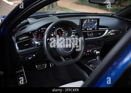 Interior View of an Audi RS6 Avant Station Wagon Cockpit Featuring Leather Steering Wheel and Infotainment Screen Stock Photo