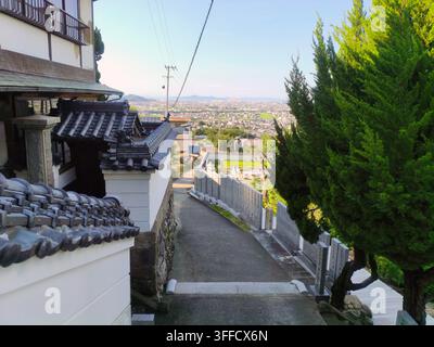 expansive urban valley overlooking the residential cityscape of Zentsuji from Mandaraji, the seventy-second stop of the Shikoku Henro pilgrimage in Ze Stock Photo