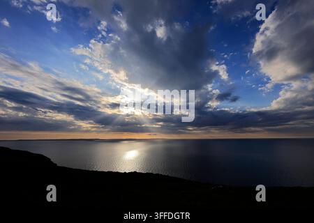 Sunset clouds over the Menai Strait from the Great Orme, Llandudno town, Conwy, North Wales, Britain. Stock Photo