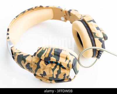 Camouflage gaming headphones with a braided cable are isolated on white Stock Photo