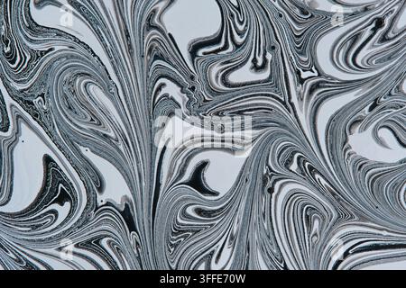 High contrast black and white marble fluid art with intricate swirls and detailed lines Stock Photo