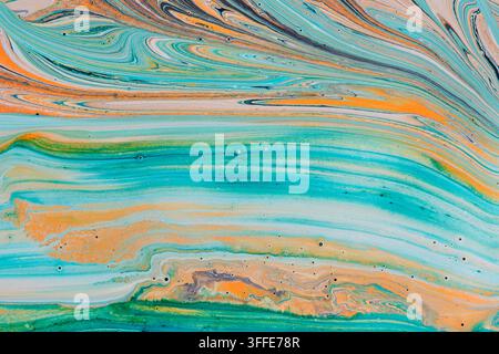 Horizontal waves turquoise orange and beige liquid paint forming soft pastel abstract art Stock Photo