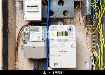 Electrical panel with digital meters, circuit breakers, and wiring. Telsiai, Lithuania. 09-08-2026. Stock Photo