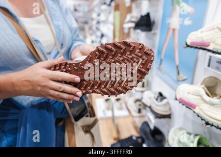 Close-Up of Textured Sneaker Sole in Footwear Store Stock Photo