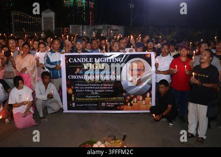 People take part in Candlelight vigil held at Kangla gate, Imphal against the killing of Musician Chongtham Vikram in Delhi following an alleged assault, demanding justice and an end to racism. Stock Photo