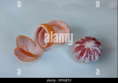 Grapefruit citrus fruit with half isolated on white with clipping path.Peeled grapefruit Stock Photo