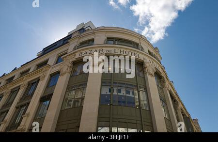 PARIS, FRANCE - SEPTEMBER 1, 2026 - BHV department store building with its name on the curved facade under a blue sky Stock Photo