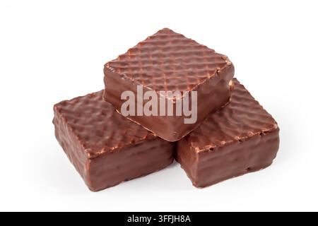 Glazed chocolate waffles on a white background. A bunch of waffle bars. Confectionery close-up. Stock Photo