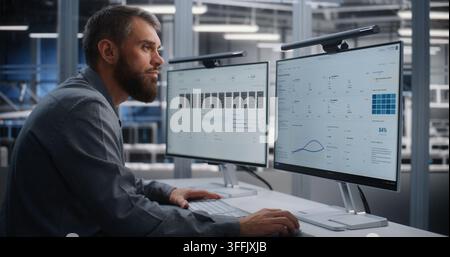 Young Data Center Engineer Monitors Infrastructure From Glass walled Control Room and Rapidly Responds to Critical Overheating Alert, Demonstrating Incident Management and Operational Resilience. Stock Photo