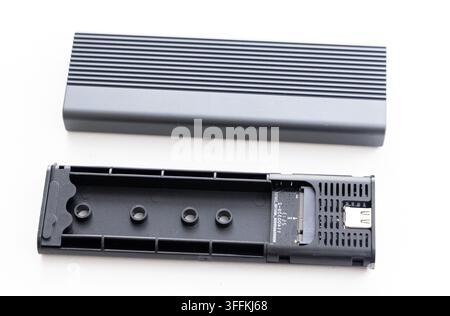 A disassembled M2 SSD enclosure with its parts visible on white Stock Photo