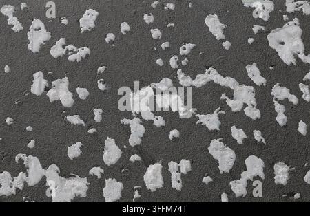 External thermal insulation wall completely destroyed by a heavy hailstorm. Close up. Background and texture. Stock Photo