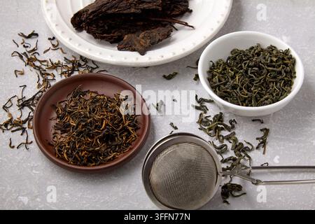 Dried Tea Varieties with Metal Mesh Strainer Stock Photo