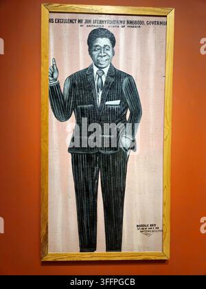 Stockholm, Sweden, January 11, 2026. Framed vintage painted portrait of a smiling man wearing a pinstripe suit and tie, posed with one hand raised. Wa Stock Photo