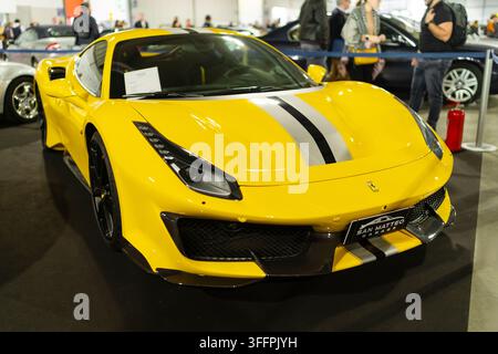 Milan, Italy - 12.11.2022: Sleek yellow Ferrari sports car at auto show exhibition. Milano Autoclassica exhibition Stock Photo