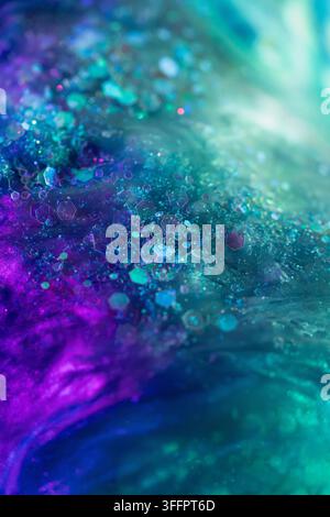 Abstract macro background featuring scattered hexagonal particles in vivid turquoise, teal, blue, and purple hues, illuminated by soft glowing light a Stock Photo