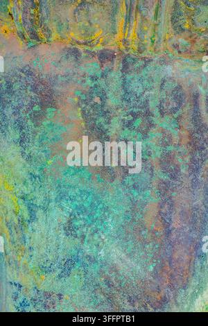 Abstract weathered surface with turquoise, teal, ochre and rust tones, featuring layered patina, organic stains and distressed marks for a natural art Stock Photo