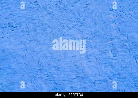 Abstract blue plaster wall with a softly uneven rough surface, featuring subtle marks and natural tonal variation. Ideal as a clean background, textur Stock Photo