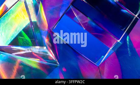 Futuristic abstract background with overlapping iridescent glass prisms reflecting vivid blue, purple, green, and pink light in a luminous geometric c Stock Photo