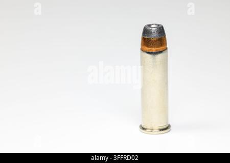 The .38 Special Semi Jacketed Hollow Point bullet isolated on white background Stock Photo
