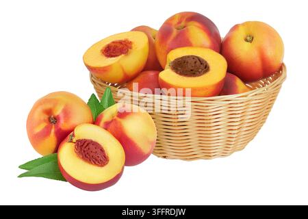 Ripe nectarine fruit with half in a wicker basket isolated on white background with full depth of field Stock Photo