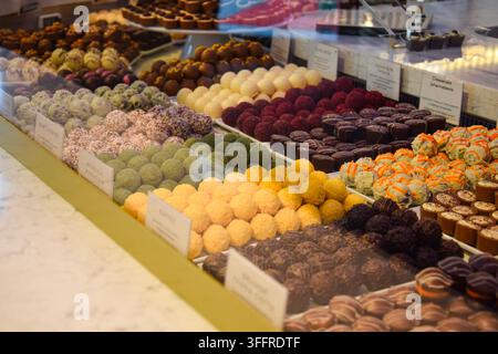 Colorful Chocolate Pralines Displayed in a Café in Berlin, Germany Stock Photo