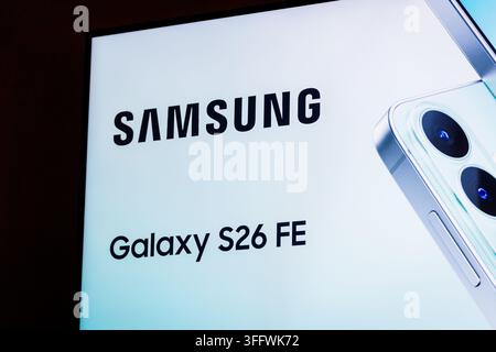 RIGA, LATVIA. 25th August 2026. Presentation screen showcasing the brand name Samsung Galaxy S26 FE alongside a close-up visual of the smartphone's re Stock Photo