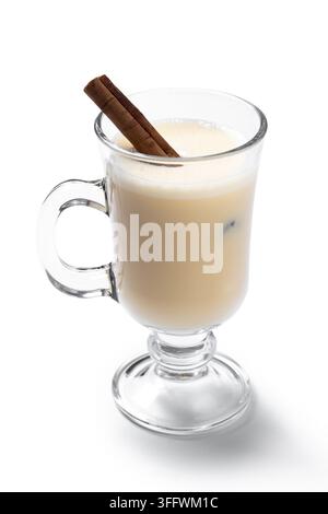 Glass of eggnog with cinnamon sticks isolated on white background Stock Photo