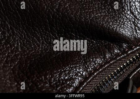 Luxury fashion and leather goods, dark brown textured material with metal zipper detail for premium accessories and high quality craftsmanship design Stock Photo