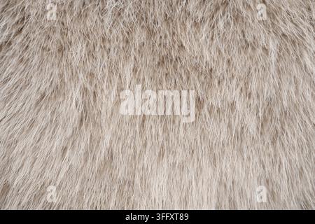 Light beige faux fur texture background with soft flowing fibers Stock Photo