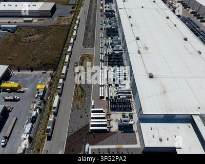 Aerial view of a large data center facility and cooling equipment Stock Photo