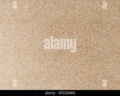 A detailed closeup of a natural cork board texture, perfect for background designs, evoking organization and productivity. Ideal for office mockups or Stock Photo