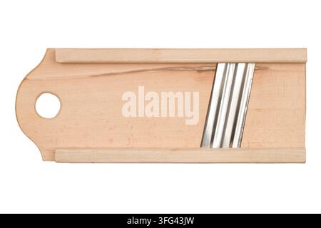 Wooden vegetable grater on a white background. The kitchen vegetable grater is isolated. Stock Photo