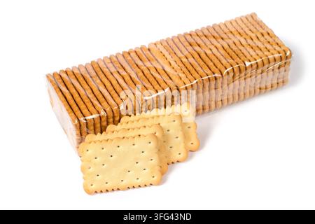 Packing cookies on a white background. Biscuits in plastic packaging. In the foreground are cookies without packaging. Stock Photo