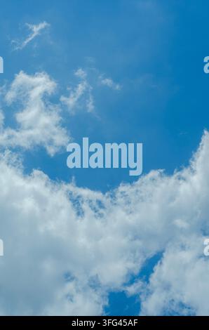 Soft White Clouds Floating in Deep Blue Atmosphere Stock Photo