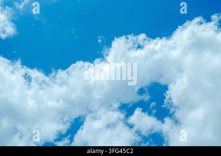 Soft White Clouds Floating in Deep Blue Atmosphere Stock Photo