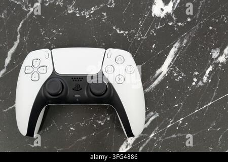 Bogota, Colombia - August 2026 Ps5 dualsense controllers in black and white on a marble background Stock Photo