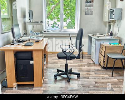 Kirov, Russia - August 4, 2026: A clinical office contains multiple workstations, patient seating, storage cabinets and electronic diagnostic devices Stock Photo