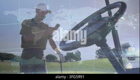 Checking golfer wearing baseball cap and striped polo, holding golf club, phone on fairway with HUD Stock Photo