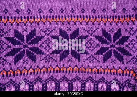 Nordic Knit Pattern Background. Texture Christmas sweater. Purple color Stock Photo