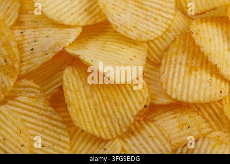 Lots of potato chips, texture close up Stock Photo